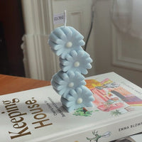 BOUGIE DE MARGUERITES EMPILÉES