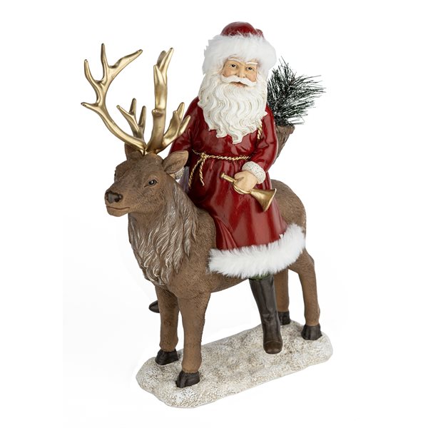 PÈRE NOEL ASSIS SUR UN RENNE