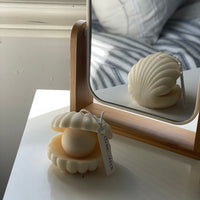 BOUGIE EN FORME DE COQUILLAGE PERLÉ